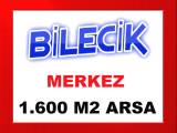 bilecik merkez de kadastral yolu olan ilçeye 600 metre mesafede 1.600 m2 arsa